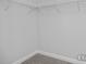 Empty walk-in closet with wire shelving and neutral carpet at 420 Longleaf Glen Ln, Zebulon, NC 27597