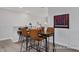Charming game room with carpeted floor, desk, and mounted Connect Four game at 420 Longleaf Glen Ln, Zebulon, NC 27597