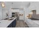 Bright kitchen with a large island, stainless steel appliances, and white cabinetry with a contemporary backsplash at 420 Longleaf Glen Ln, Zebulon, NC 27597