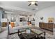 Bright, open-concept living room flows into the modern kitchen, featuring stylish furniture and decor at 420 Longleaf Glen Ln, Zebulon, NC 27597