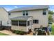 Backyard showing a screened porch, grill, hot tub, and outdoor seating at 513 Heswall Ct, Rolesville, NC 27571