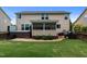 Spacious backyard with patio, hot tub, grill and green lawn at 513 Heswall Ct, Rolesville, NC 27571