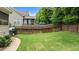 Spacious fenced backyard with a lush green lawn and a patio at 513 Heswall Ct, Rolesville, NC 27571