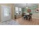 Cozy dining room featuring light green walls, and natural light at 513 Heswall Ct, Rolesville, NC 27571
