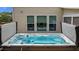 Inviting hot tub with a view of the yard through three windows at 513 Heswall Ct, Rolesville, NC 27571