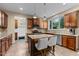 Kitchen features stainless appliances, an island with counter seating and granite countertops at 513 Heswall Ct, Rolesville, NC 27571