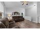 Inviting living room with hardwood floors, ceiling fan, and comfortable seating at 513 Heswall Ct, Rolesville, NC 27571