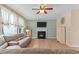 Comfortable living room with fireplace, ceiling fan, and neutral decor at 513 Heswall Ct, Rolesville, NC 27571