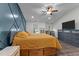 Spacious main bedroom featuring a ceiling fan and accent wall at 513 Heswall Ct, Rolesville, NC 27571