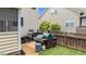 Back patio with grill, outdoor seating, and privacy fence at 513 Heswall Ct, Rolesville, NC 27571