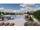 A large community pool featuring splash pad, shaded seating, and plenty of lounge chairs at 549 Contempo Ct # 6, Rolesville, NC 27571