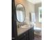 Bathroom features a dark vanity with a sink, toilet, and walk-in shower at 550 Saplin Branch Rd, Timberlake, NC 27583
