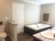 Bright bathroom features a soaking tub, modern fixtures, and neutral decor, providing a serene and relaxing space at 550 Saplin Branch Rd, Timberlake, NC 27583