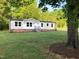 Charming single-story home with a well-maintained lawn, brick foundation, and inviting front entrance at 550 Saplin Branch Rd, Timberlake, NC 27583