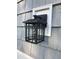 Exterior light fixture with seeded glass panels and classic design at 550 Saplin Branch Rd, Timberlake, NC 27583