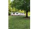 Charming home surrounded by mature trees with a well-manicured lawn at 550 Saplin Branch Rd, Timberlake, NC 27583
