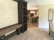 Open living space with custom built-ins, and view into the modern kitchen, creating a seamless flow for entertaining at 550 Saplin Branch Rd, Timberlake, NC 27583