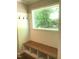 Functional mudroom area features a built-in bench with storage and coat hooks, offering a convenient space to organize belongings at 550 Saplin Branch Rd, Timberlake, NC 27583
