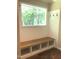 Functional mudroom area features a built-in bench with storage and coat hooks, offering a convenient space to organize belongings at 550 Saplin Branch Rd, Timberlake, NC 27583