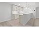 Modern basement bar area featuring white cabinetry, countertop seating, and under-cabinet lighting at 569 Freedom Trail Dr, Willow Springs, NC 27592