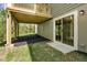Exterior view of the basement area, featuring a sliding glass door and access to the backyard at 569 Freedom Trail Dr, Willow Springs, NC 27592