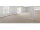 Spacious basement area with a large window, sliding glass door, and neutral carpeting at 569 Freedom Trail Dr, Willow Springs, NC 27592
