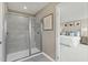 Bathroom with walk-in shower and a view to the primary bedroom at 569 Freedom Trail Dr, Willow Springs, NC 27592