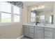 Bathroom featuring double vanity, modern lighting, and a large mirror at 569 Freedom Trail Dr, Willow Springs, NC 27592
