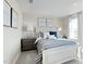Bright bedroom with large window, neutral walls, and soft carpeting at 569 Freedom Trail Dr, Willow Springs, NC 27592