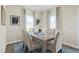 Cozy dining room with stylish chairs and decor, enhanced by natural light from the window views at 569 Freedom Trail Dr, Willow Springs, NC 27592
