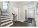 Welcoming foyer with hardwood floors, staircase, and a view of the front door at 569 Freedom Trail Dr, Willow Springs, NC 27592
