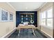Stylish home office featuring built-in shelving, natural light, and modern decor at 569 Freedom Trail Dr, Willow Springs, NC 27592