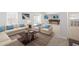Bright and open living room featuring ample seating, stylish decor, and access to a lower level bar area at 569 Freedom Trail Dr, Willow Springs, NC 27592