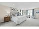 Serene main bedroom with elegant decor, plush carpeting, and natural light from large windows at 569 Freedom Trail Dr, Willow Springs, NC 27592