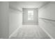 Spacious walk-in closet with ample shelving and natural light at 569 Freedom Trail Dr, Willow Springs, NC 27592