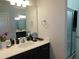 Modern bathroom with a sleek vanity, glass-enclosed shower, and decorative fixtures at 633 Longstanton Ave, Zebulon, NC 27597