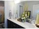 Bright bathroom with a double sink vanity, modern fixtures, and decorative accents at 633 Longstanton Ave, Zebulon, NC 27597