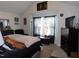 Bedroom with vaulted ceiling, large window, and a comfortable bed at 633 Longstanton Ave, Zebulon, NC 27597