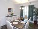 Elegant dining room boasts a decorative chandelier, a stylish buffet, and seating for six at 633 Longstanton Ave, Zebulon, NC 27597