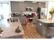 Modern kitchen featuring stainless steel appliances, granite countertops, and breakfast bar seating at 633 Longstanton Ave, Zebulon, NC 27597