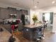 Modern kitchen featuring stainless steel appliances, granite countertops, breakfast bar and open floor plan at 633 Longstanton Ave, Zebulon, NC 27597