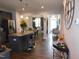 Modern kitchen with stainless steel appliances, breakfast bar and seamless view to dining room at 633 Longstanton Ave, Zebulon, NC 27597