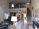 Inviting living room featuring an open floor plan, staircase, and plenty of natural light at 633 Longstanton Ave, Zebulon, NC 27597
