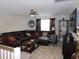 Cozy living area with a sectional sofa, area rug, and ceiling fan at 633 Longstanton Ave, Zebulon, NC 27597