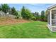 Spacious backyard with healthy lawn, fence, and mature trees at 704 Valleywater St, Fuquay Varina, NC 27526