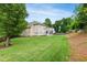 Expansive backyard with mature trees and partial fencing, perfect for outdoor living at 704 Valleywater St, Fuquay Varina, NC 27526