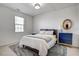 Cozy bedroom featuring a plush bed, neutral walls, soft carpet, and a statement dresser for comfort and style at 704 Valleywater St, Fuquay Varina, NC 27526
