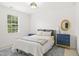 Well-lit bedroom with a queen sized bed, soft carpet, and natural light from a window at 704 Valleywater St, Fuquay Varina, NC 27526