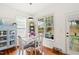Charming breakfast nook with a table set for four and natural light from large windows at 704 Valleywater St, Fuquay Varina, NC 27526