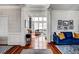 Elegant foyer with hardwood floors, detailed trim, and views into the spacious living areas of the home at 704 Valleywater St, Fuquay Varina, NC 27526